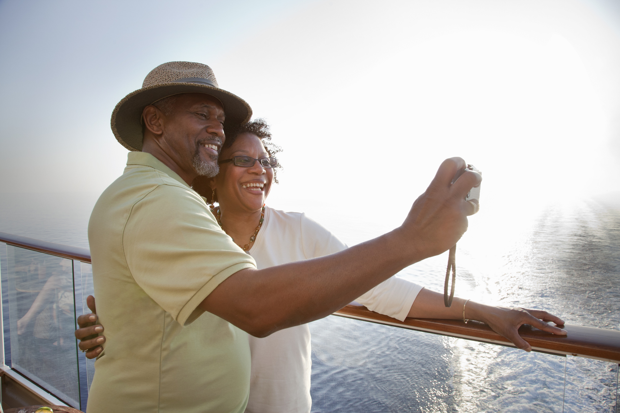 Mature African American couple posing for self portrait while on deck of a cruise ship